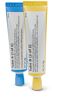 Close-up of ZELSUVMI's two tubes. Tuba A with a blue cap and Tube B with a yellow cap, used in the treatment application process